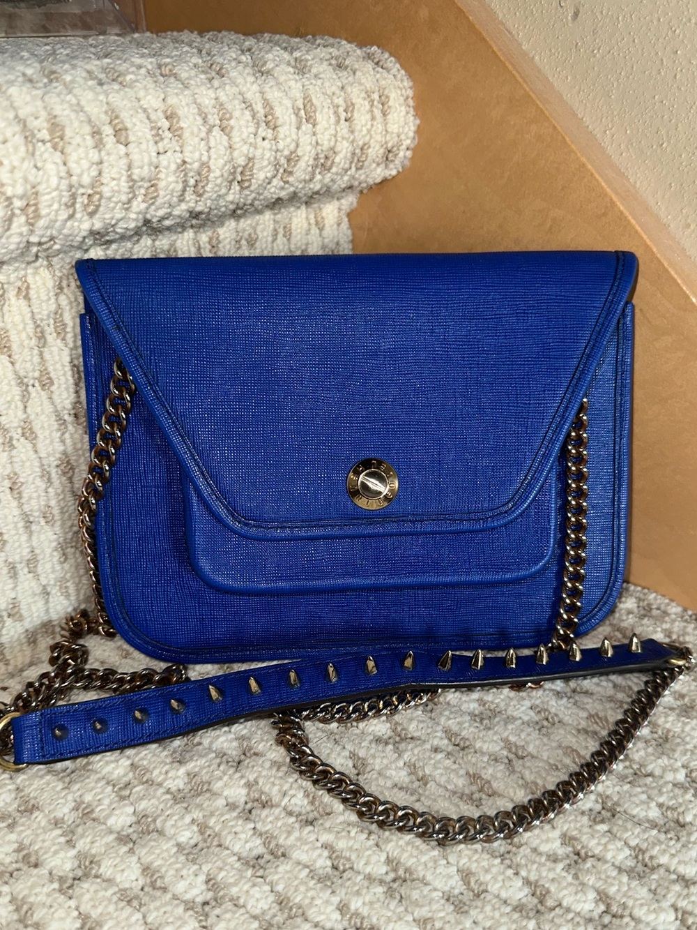 Henri Bendel West 57th Mini Crossbody in blue Saffiano leather.